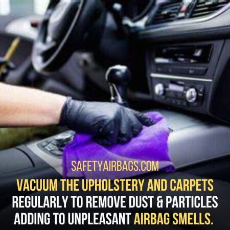Vacuum the upholstery and carpets - how to get rid of airbag smell 